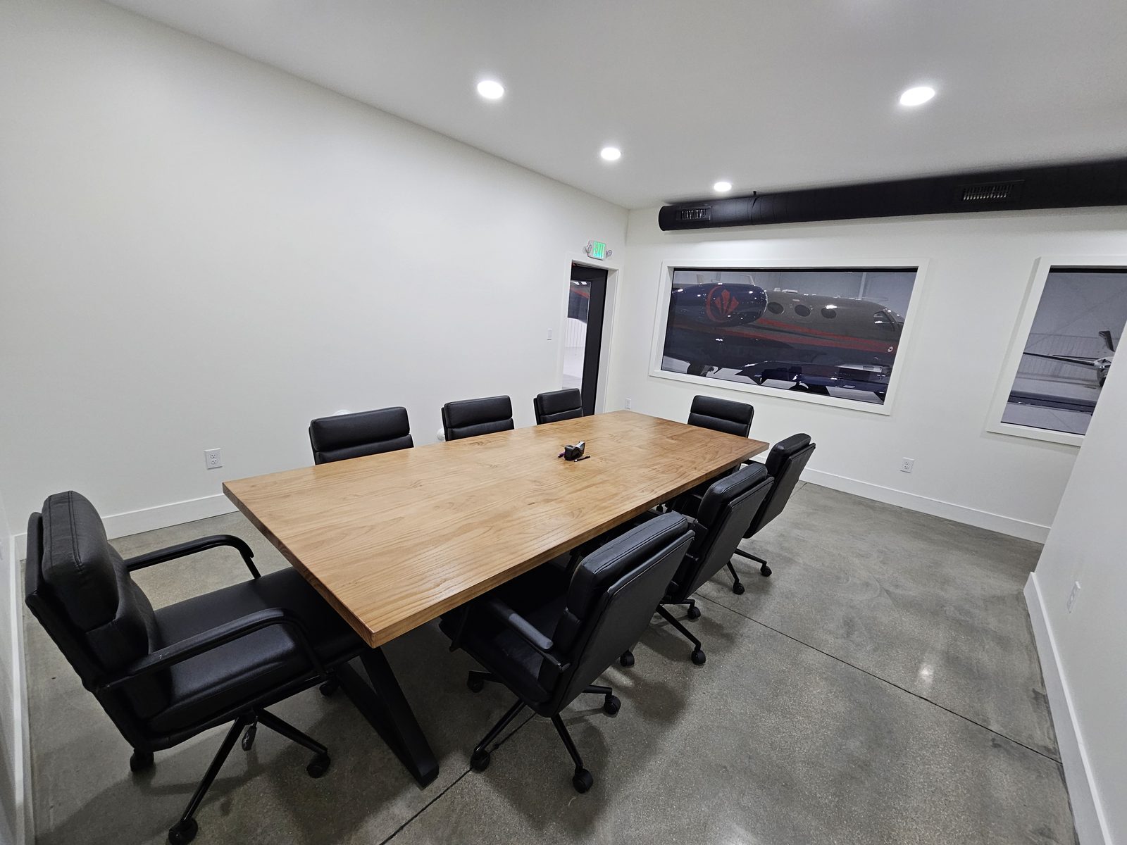 Conference room with windows overlooking the hangar floor