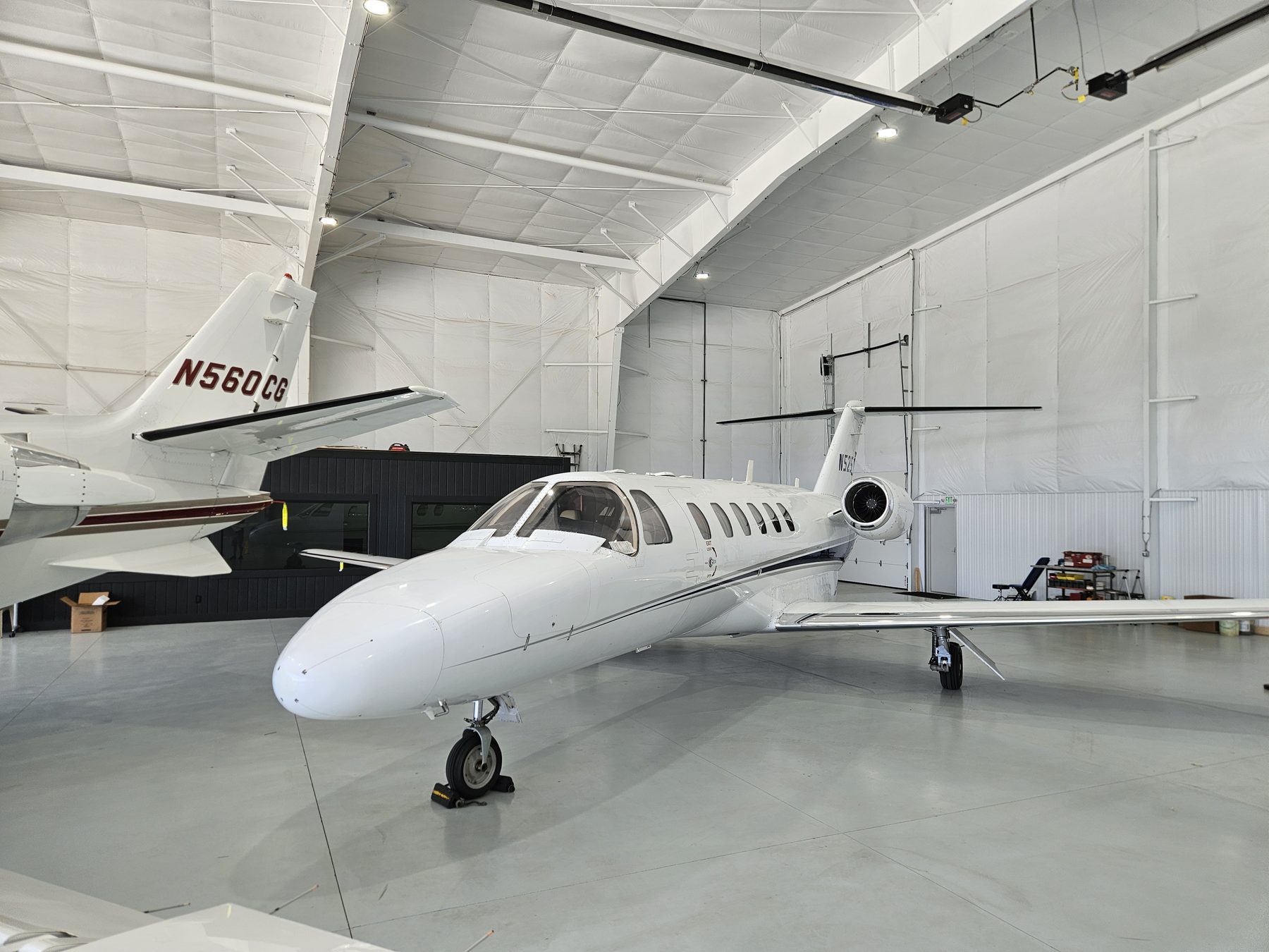 A Citation CJ2 inside the Gateway Jets corporate hangar at KCPS with a Citation Excel behind it