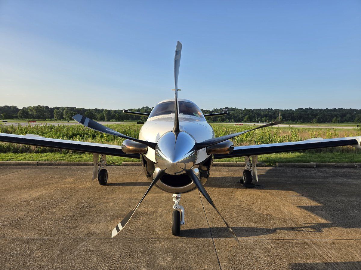 Head-on view of TBM 700C2 N6272B showing the five-blade Hartzell propeller and polished spinner