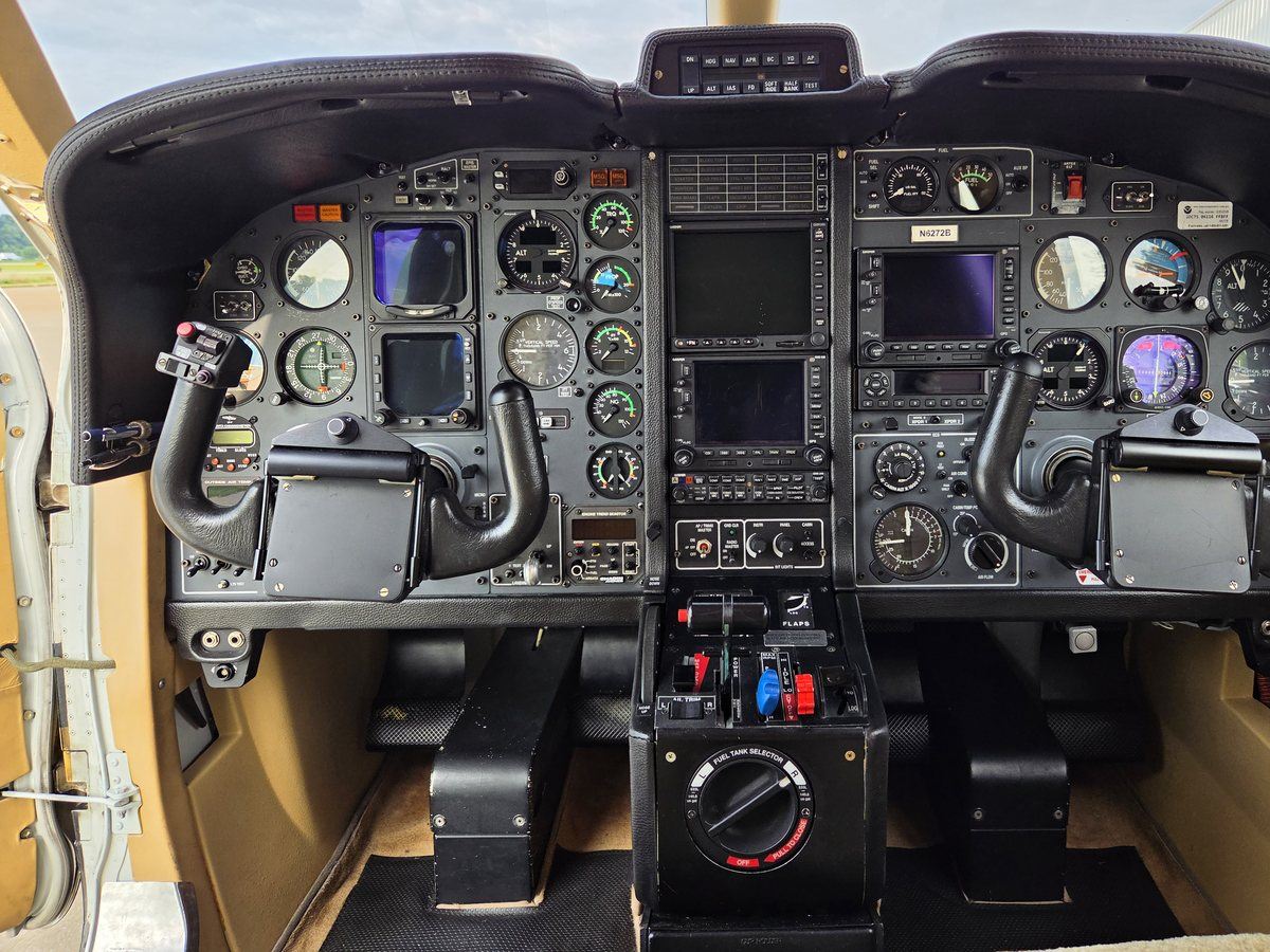 Full instrument panel of TBM 700C2 N6272B with dual control yokes and EFIS-40 flight displays